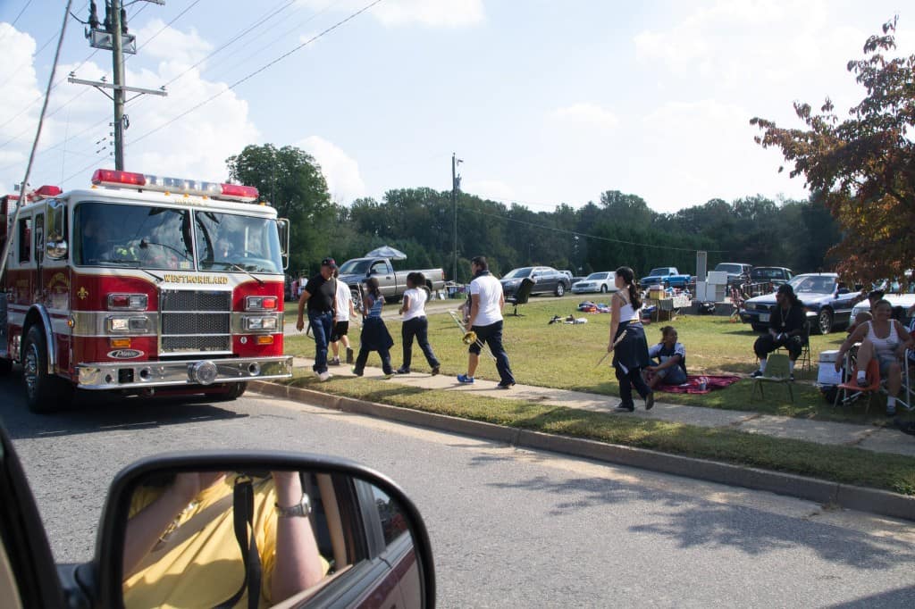 Firetrucks, and spectators along the road.