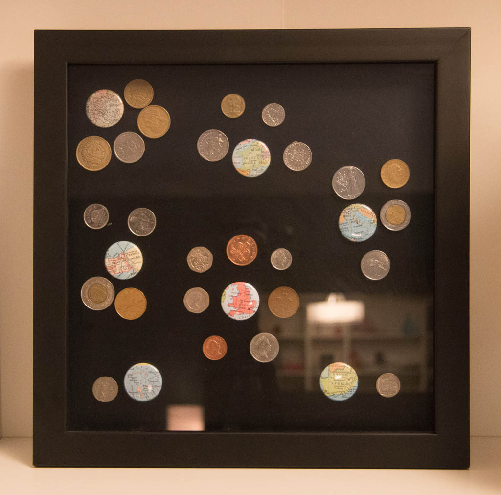 Another shadowbox displaying different foreign coins