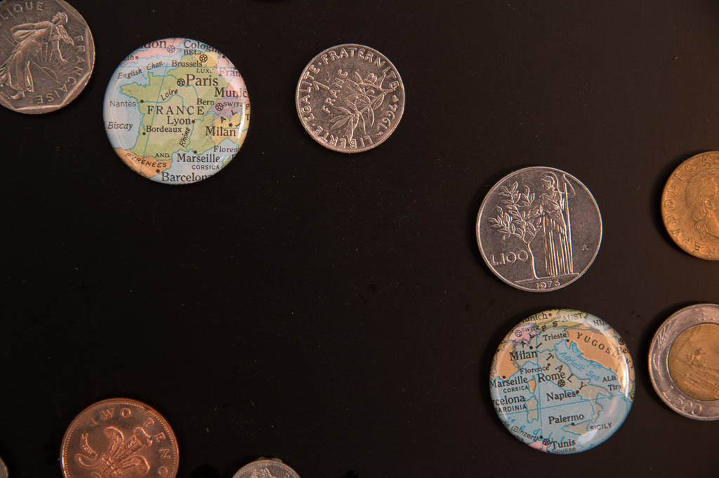 Closeup of foreign coin display and map magnets