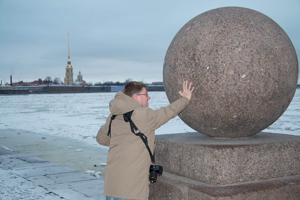 Ken tries to push huge stone ball into Neva River