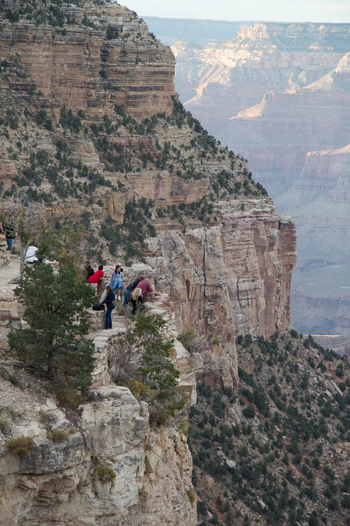 Folks standing near the edge of the grand canyon