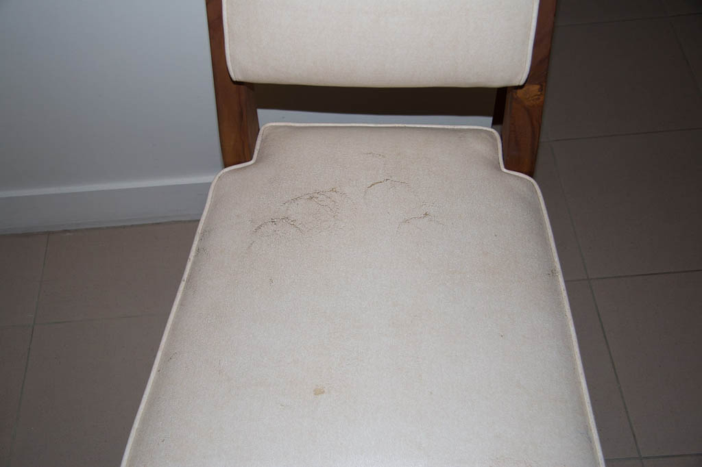 Scuff marks covering chair in hotel room at Casa Marina