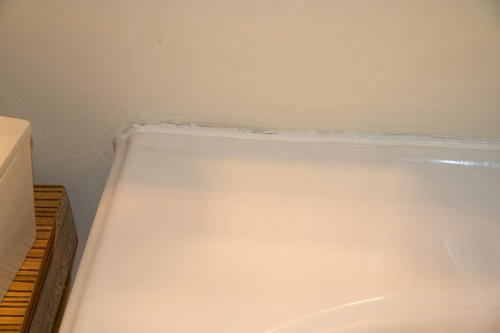 Cracked caulking on sink in hotel room