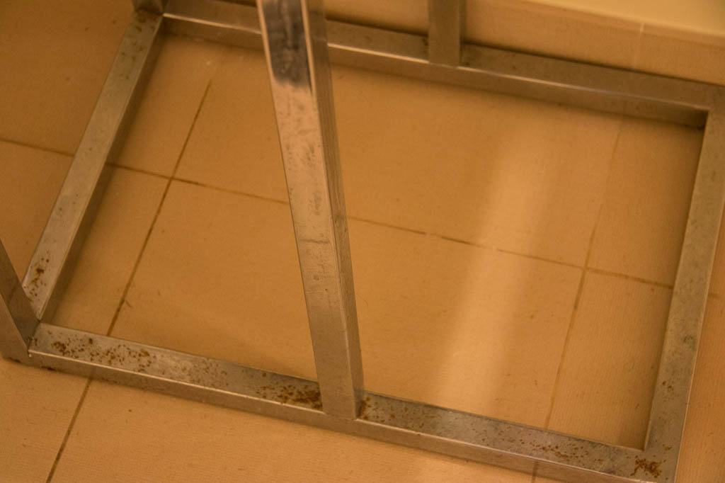 Rusting table legs on table in bathroom at Casa Marina | Waldorf Astoria | Key West