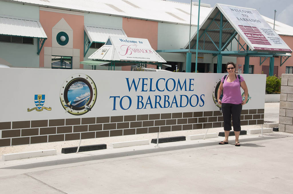 Me standing at Welcome to Barbados sign