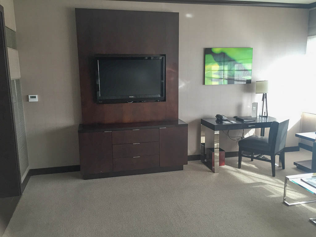 Desk, TV, and dresser in Deluxe suite