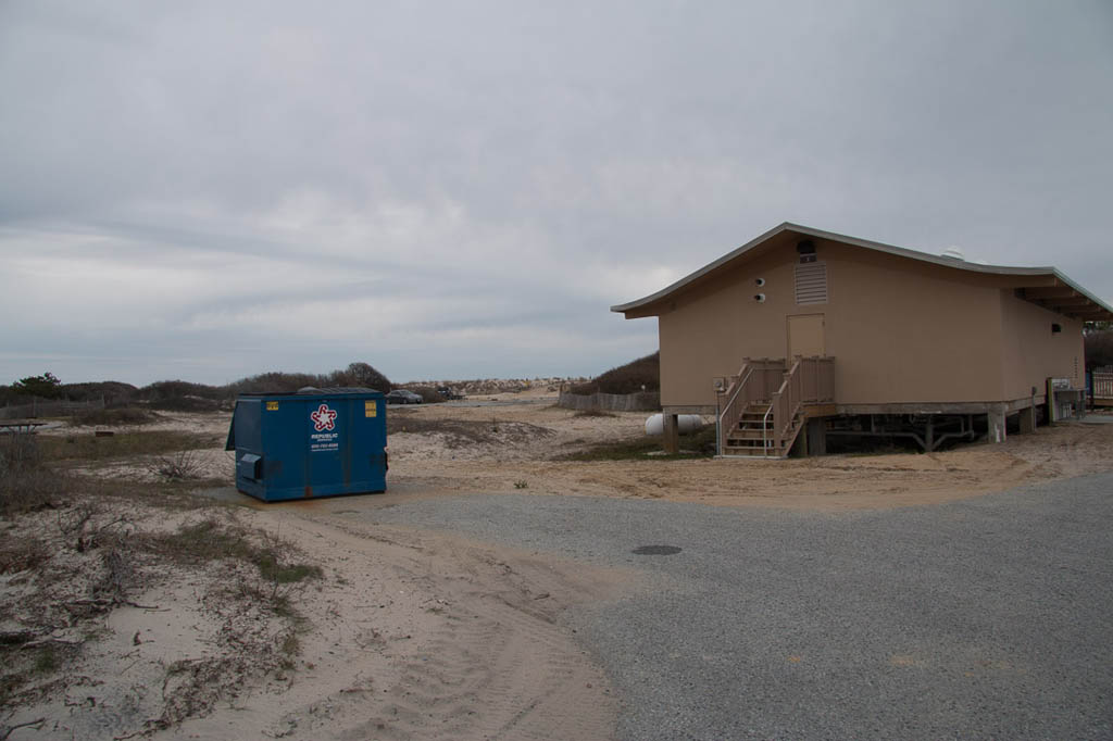 Dumpsters outside restrooms for campers