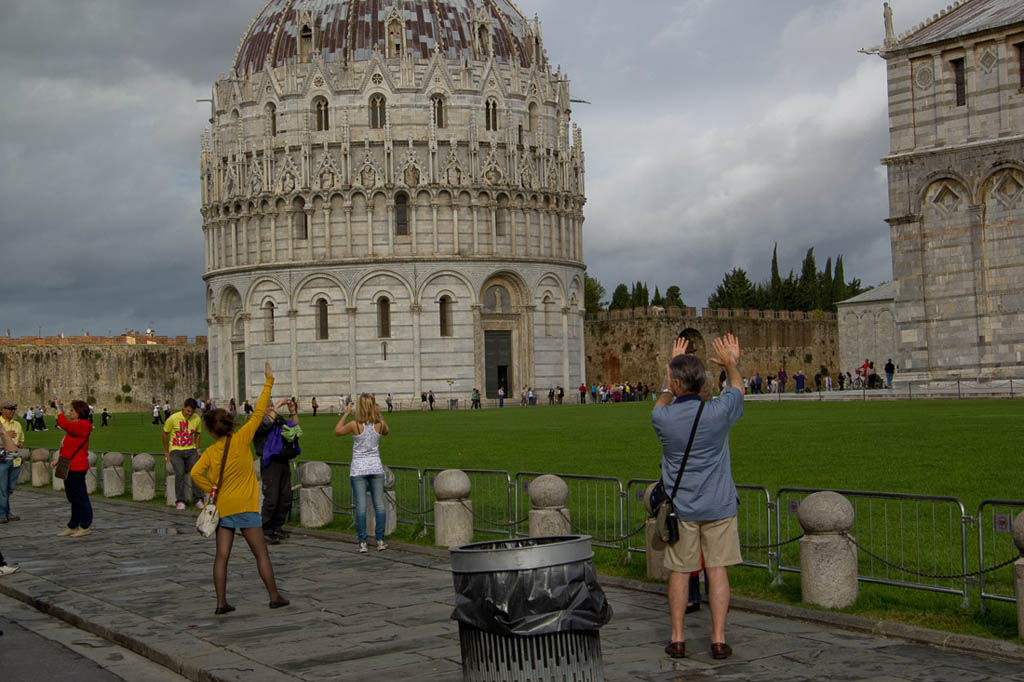 People in pose holding up Leaning Tower of Pisa