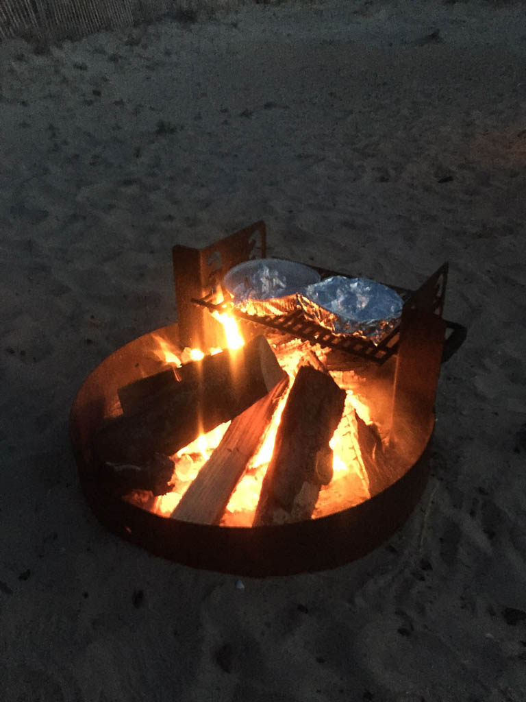 Cooking brie and meatballs over the campfire