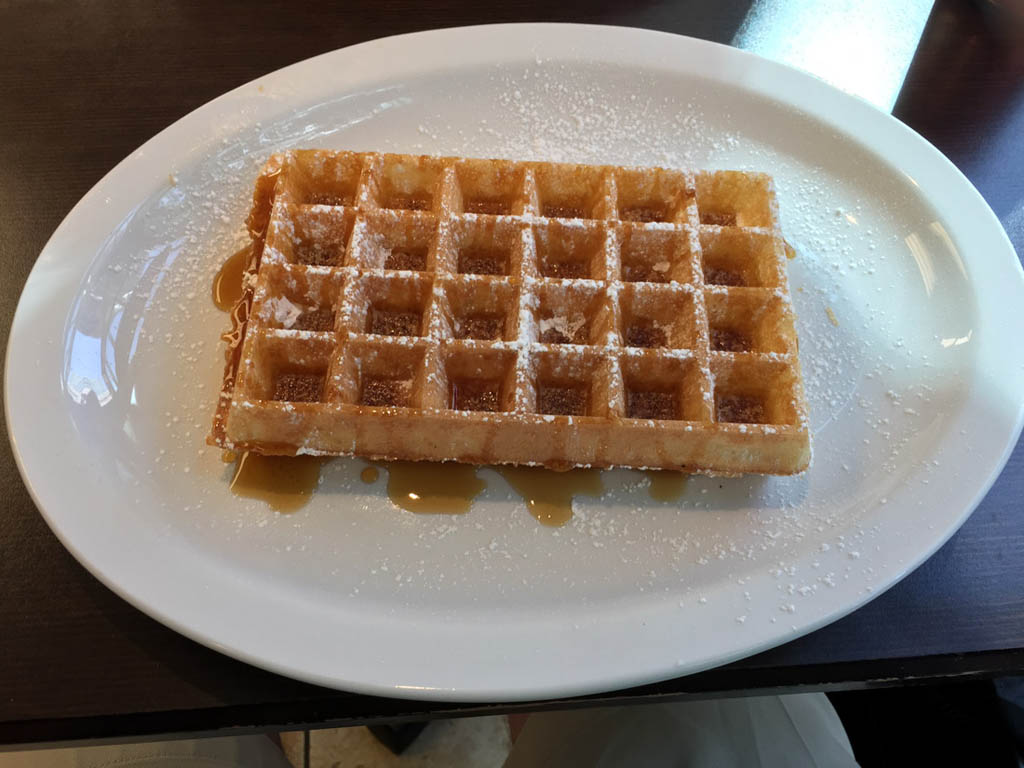 Large waffle with maple syrup