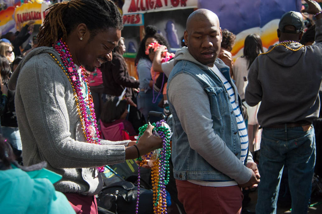 Catching throws at Krewe of Iris during Mardi Gras