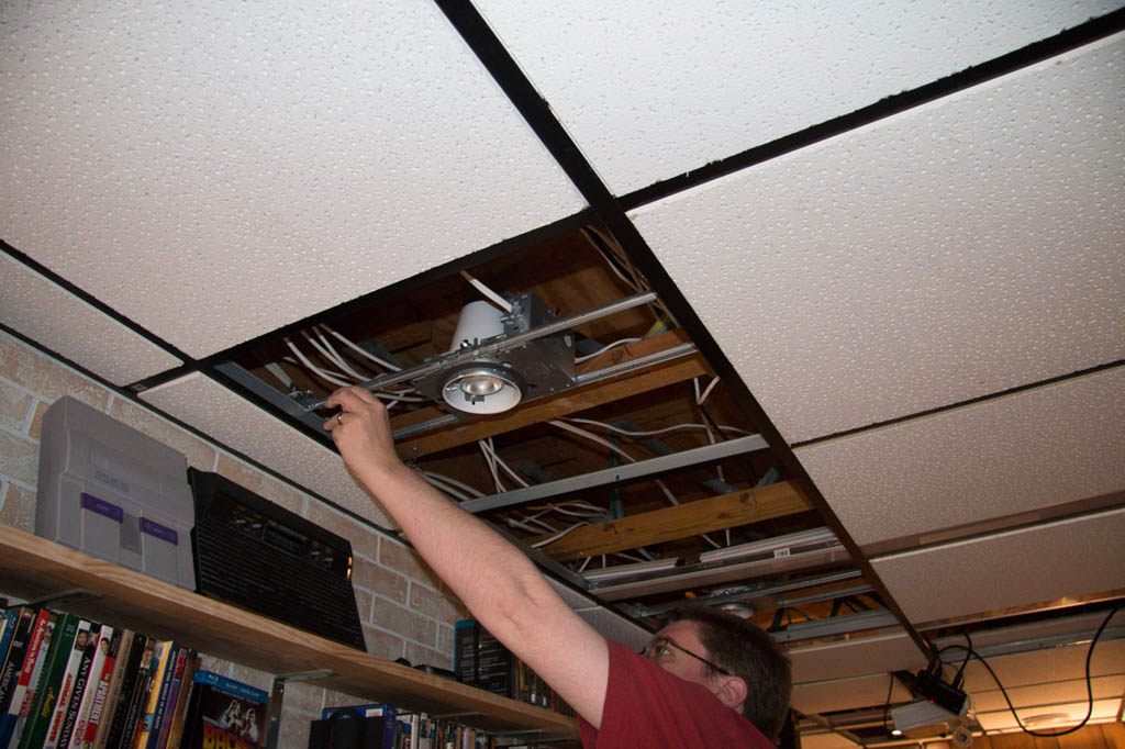 Putting cut ceiling tiles back in ceiling around recessed lighting housing
