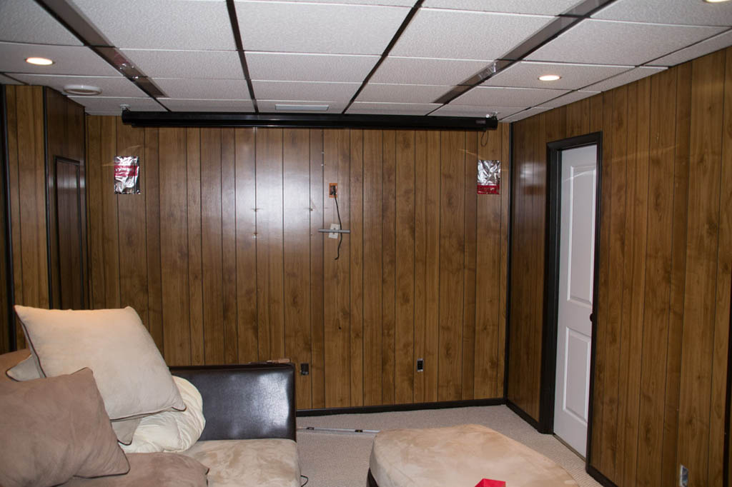 Wood paneled walls in basement