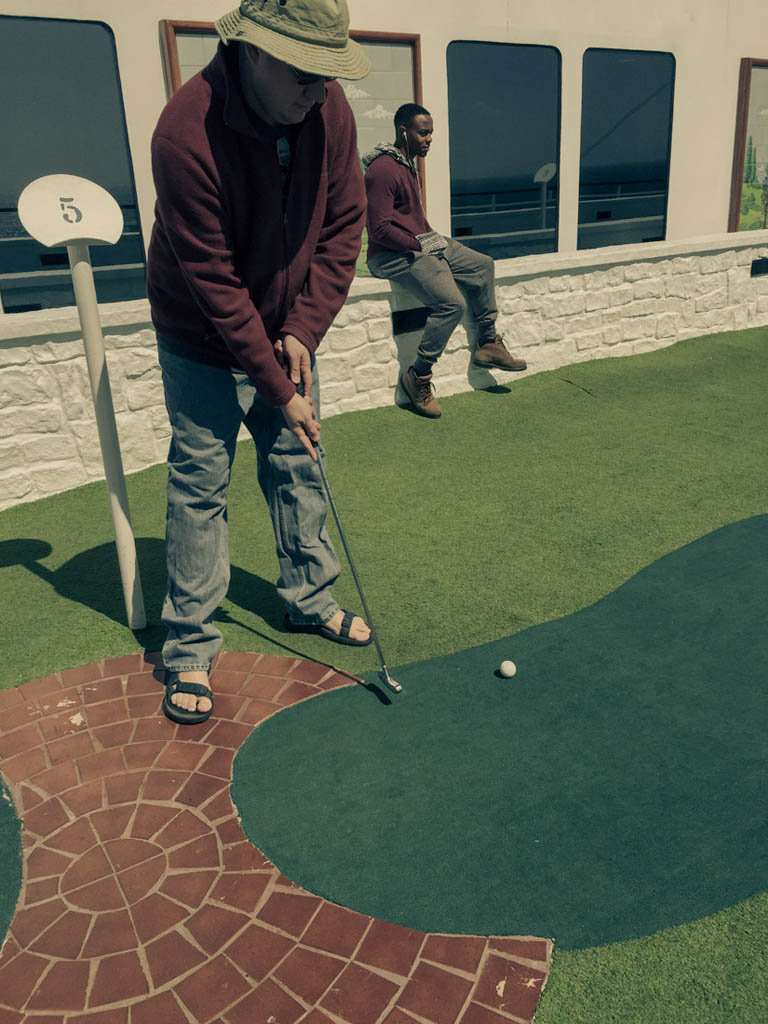 Ken playing mini golf on cruise ship