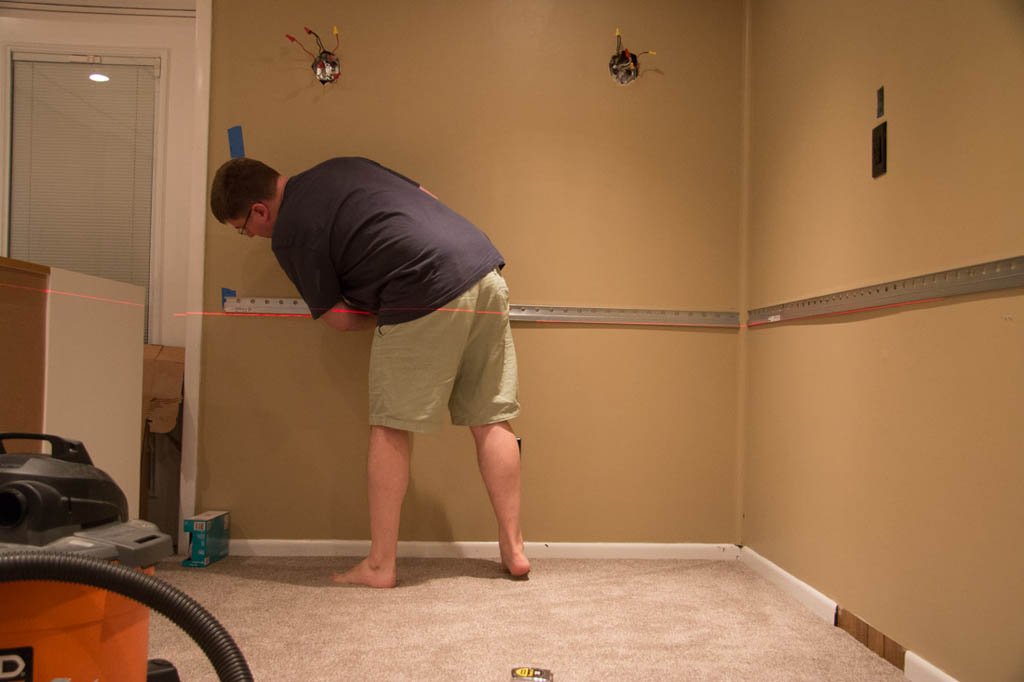 Using laser level to hang Ikea cabinet bar