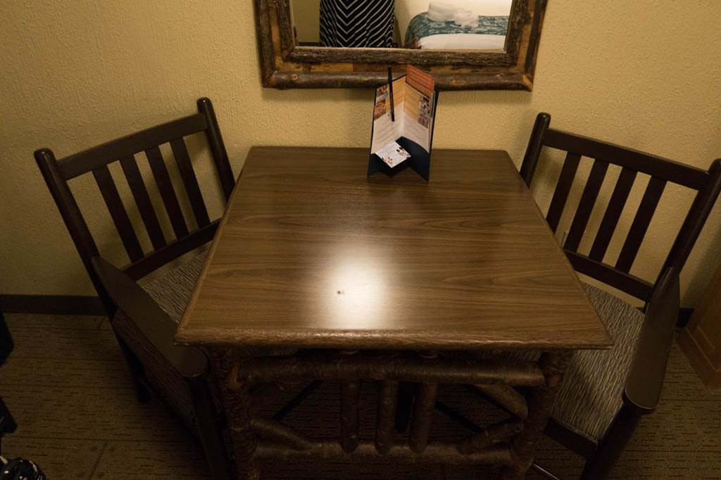 table and chairs in room at Port Orleans Riverside