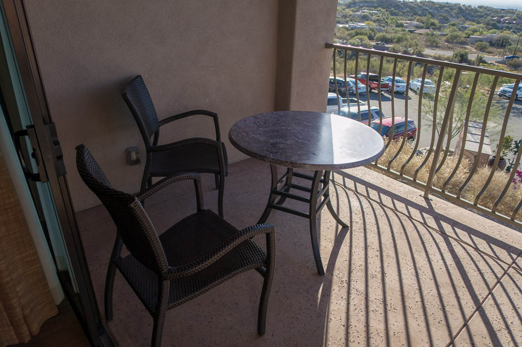 Table and chairs on balcony at Hacienda del Sol